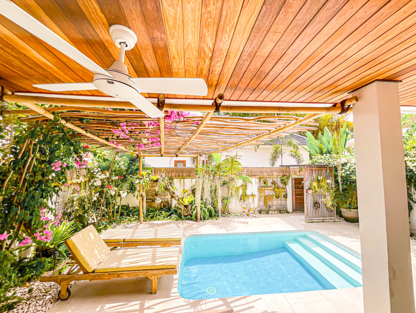 pool with comfortable lounge chairs